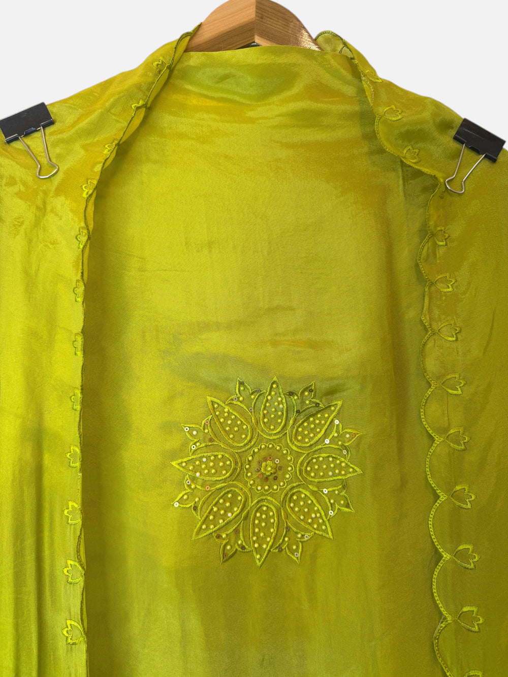 Design by Pakiza green silk organza fabric featuring intricate floral embroidery with pearl and sequin embellishments
