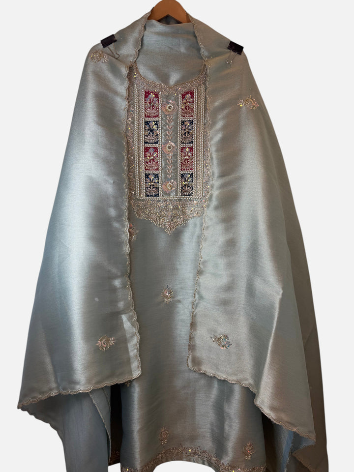 Design by Pakiza unstitched 3-piece ensemble in sage green giraffe tissue with intricate pearl and dabka handwork.