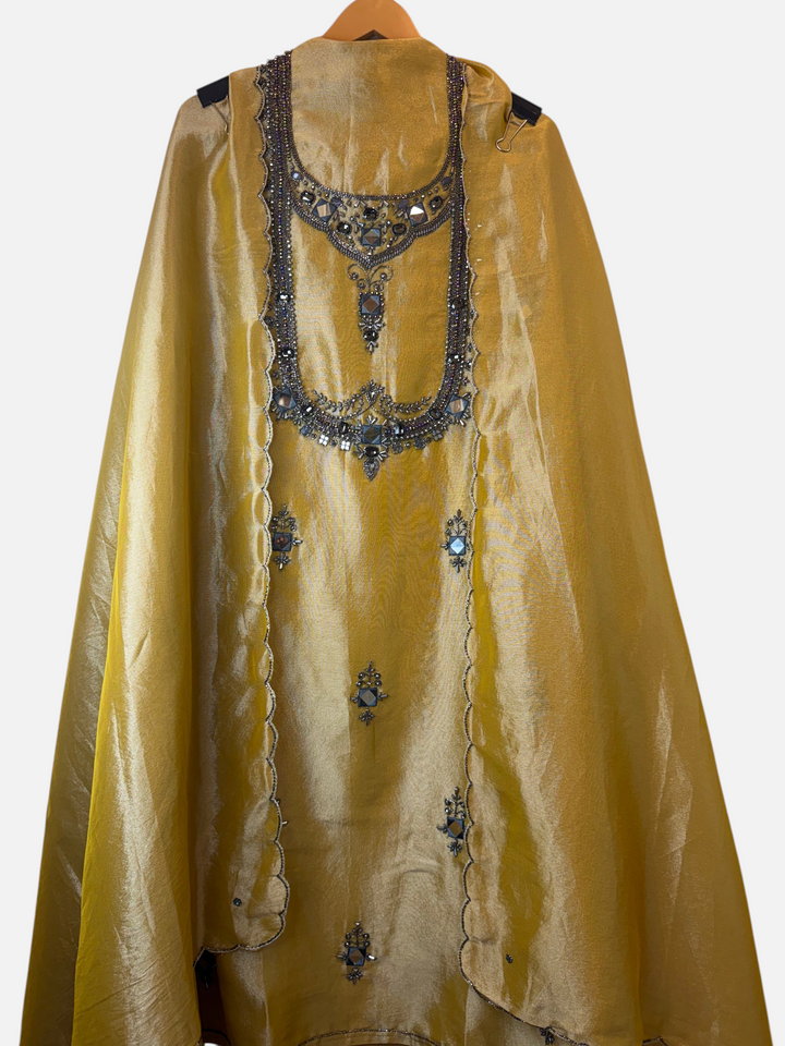 Design by Pakiza golden Kanjivaram unstitched shirt with intricate dori, sequin, and stone embellishments