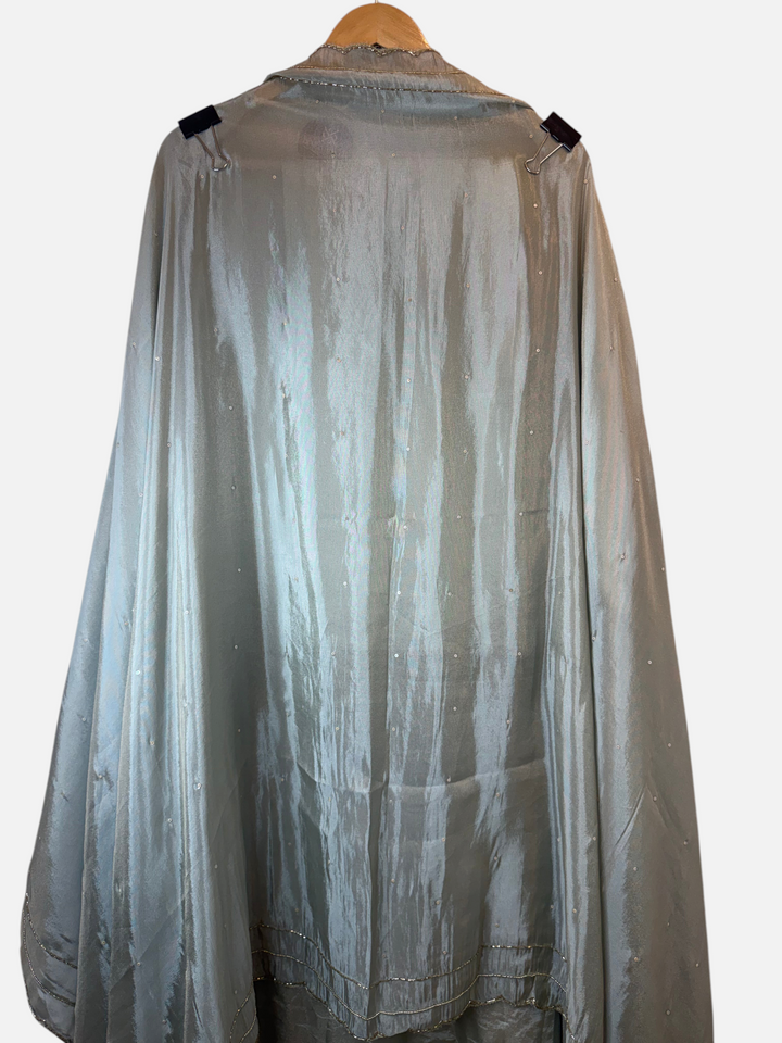 Design by Pakiza Zarqa tissue giraffe dupatta with sequin detailing and cutdana scalloped edges on a hanger